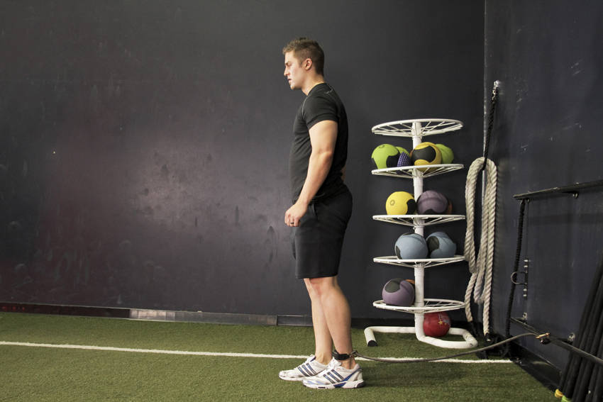 Demonstration of Hip Flexion with Band exercise showing proper form and technique