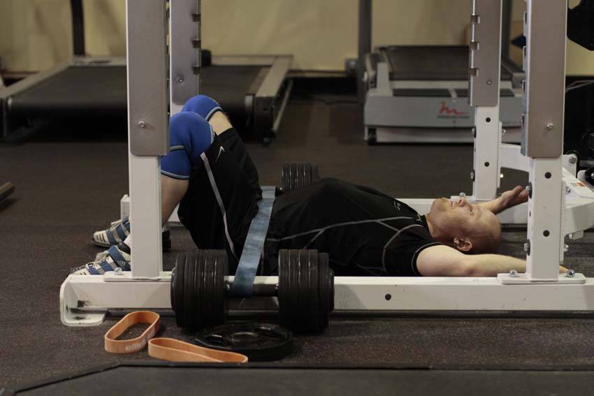 Demonstration of Hip Lift with Band exercise showing proper form and technique