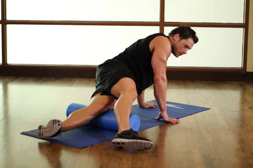 Demonstration of Iliotibial Tract-SMR exercise showing proper form and technique