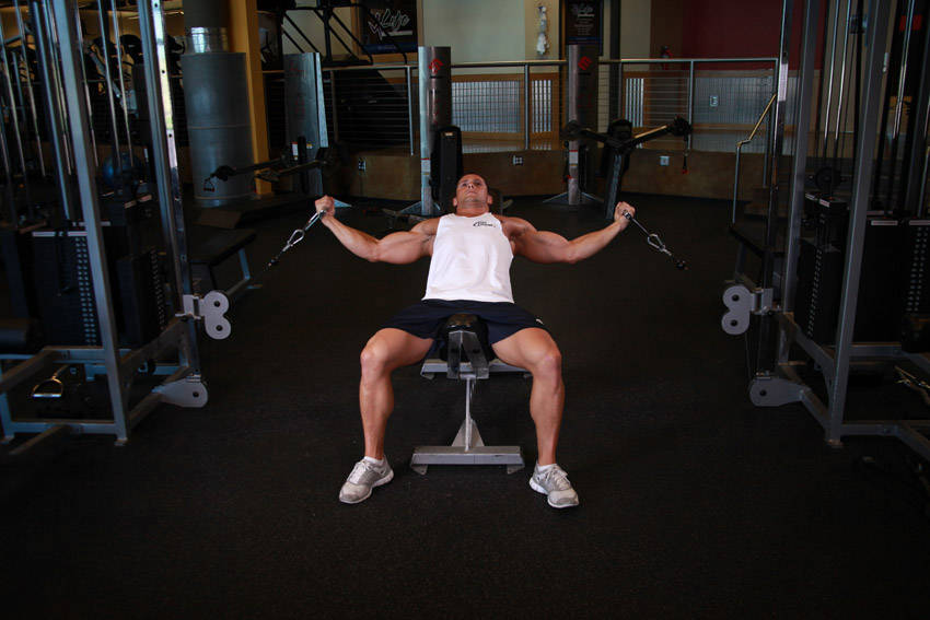 Demonstration of Incline Cable Flye exercise showing proper form and technique
