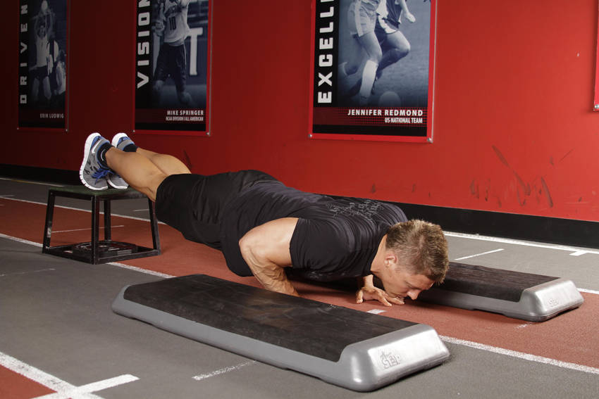 Demonstration of Incline Push-Up Depth Jump exercise showing proper form and technique