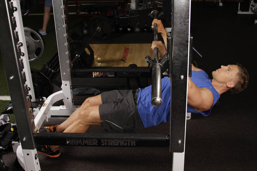 Demonstration of Inverted Row exercise showing proper form and technique