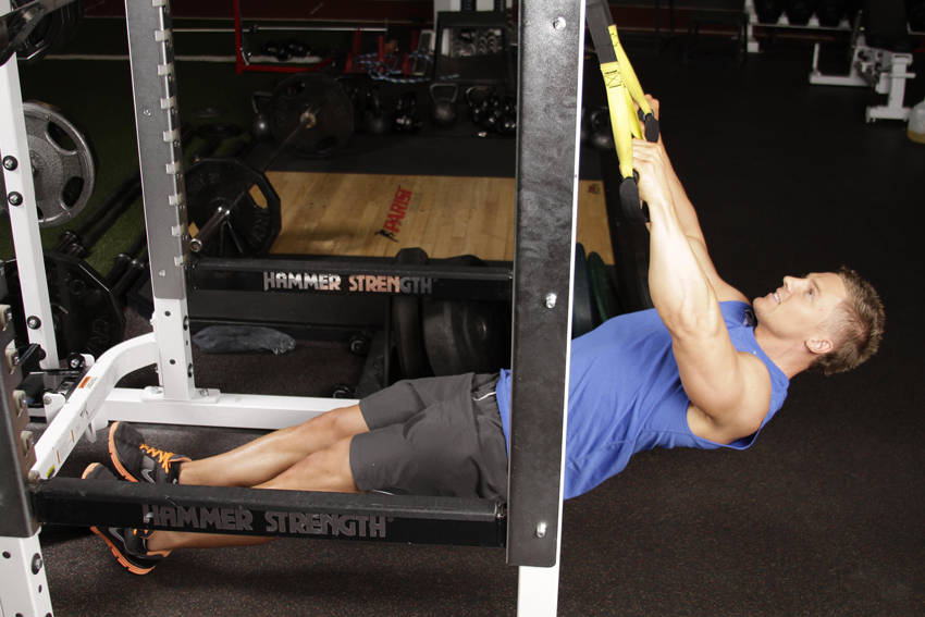 Demonstration of Inverted Row with Straps exercise showing proper form and technique