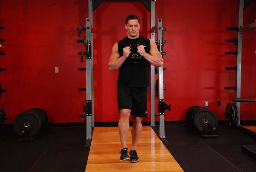 Demonstration of Kettlebell Pistol Squat exercise showing proper form and technique