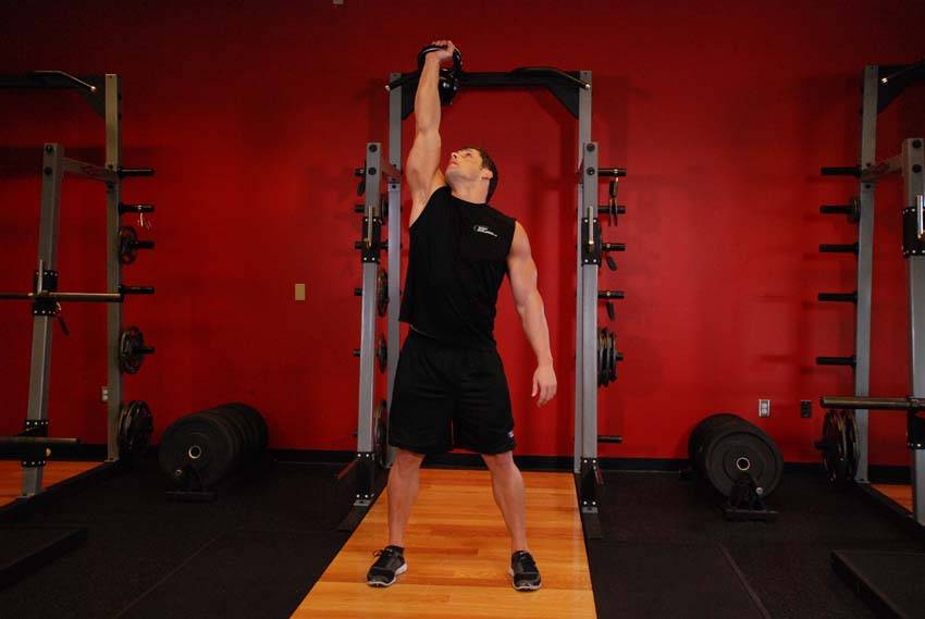 Demonstration of Kettlebell Windmill exercise showing proper form and technique