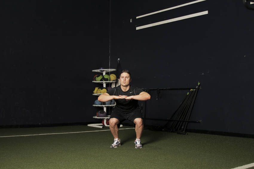 Demonstration of Knee Tuck Jump exercise showing proper form and technique