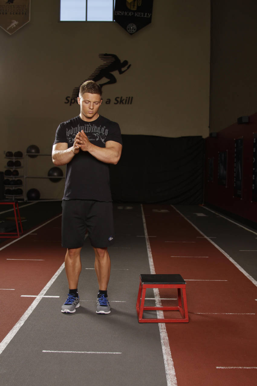 Demonstration of Lateral Box Jump exercise showing proper form and technique