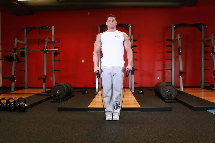 Demonstration of Lateral Raise - With Bands exercise showing proper form and technique