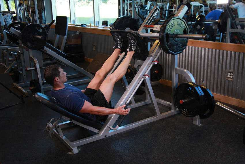 Demonstration of Leg Press exercise showing proper form and technique