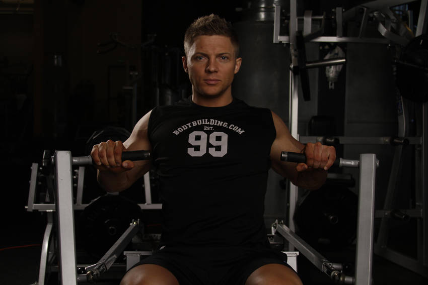 Demonstration of Leverage Chest Press exercise showing proper form and technique