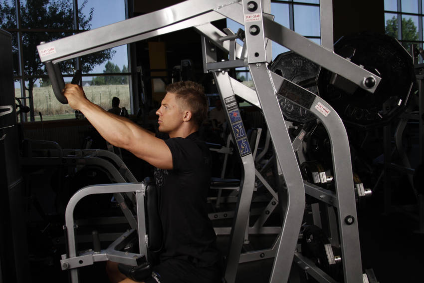 Demonstration of Leverage High Row exercise showing proper form and technique