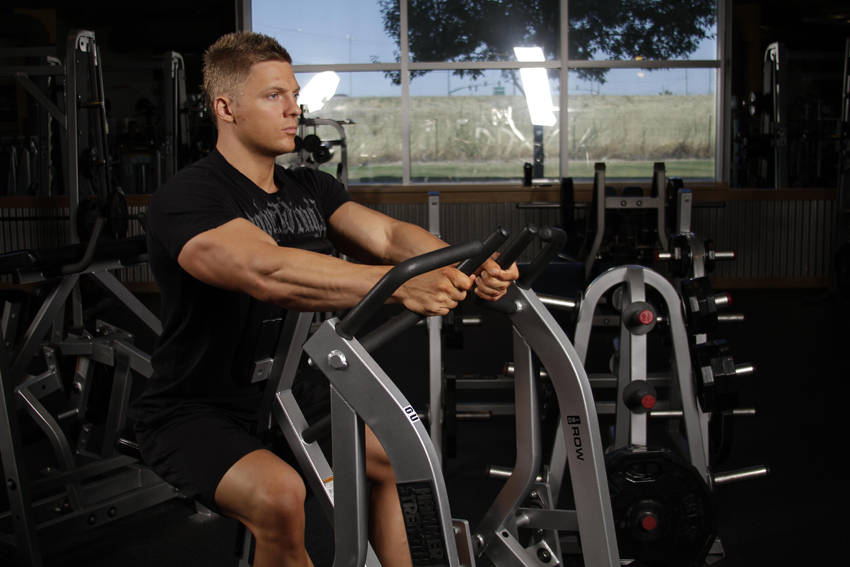 Demonstration of Leverage Iso Row exercise showing proper form and technique