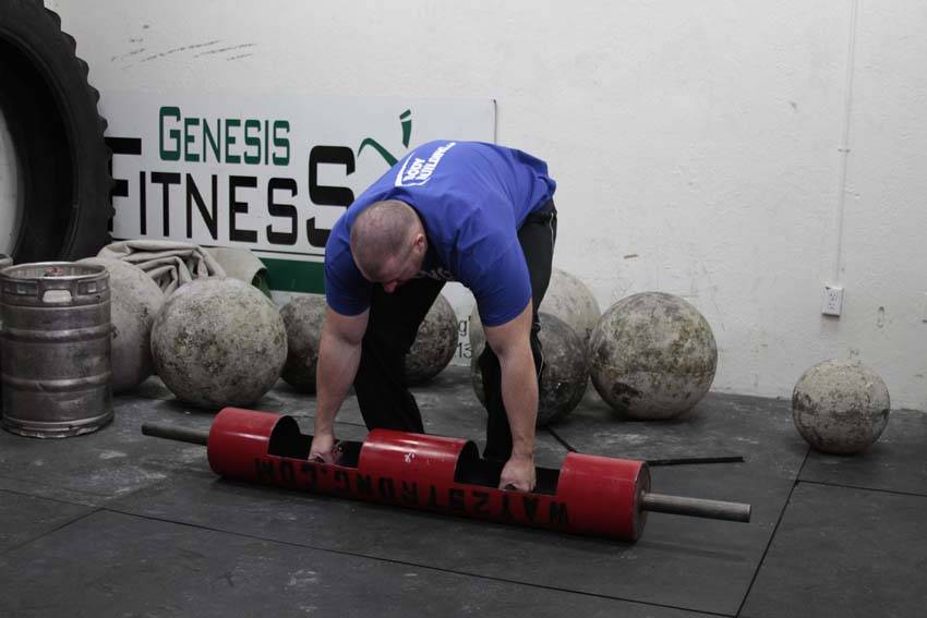 Demonstration of Log Lift exercise showing proper form and technique