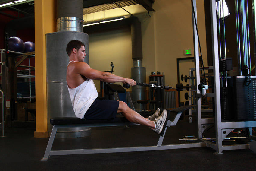 Demonstration of Low Pulley Row To Neck exercise showing proper form and technique