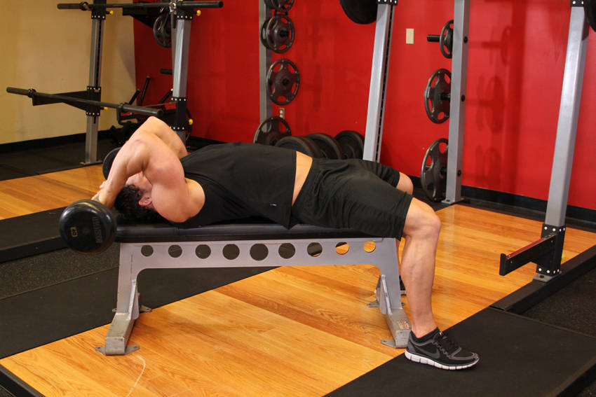 Demonstration of Lying Close-Grip Barbell Triceps Extension Behind The Head exercise showing proper form and technique