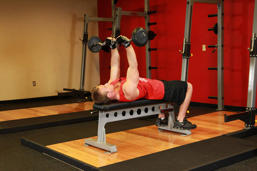 Demonstration of Lying Close-Grip Barbell Triceps Press To Chin exercise showing proper form and technique