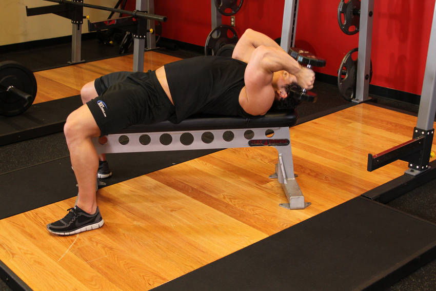 Demonstration of Lying Dumbbell Tricep Extension exercise showing proper form and technique