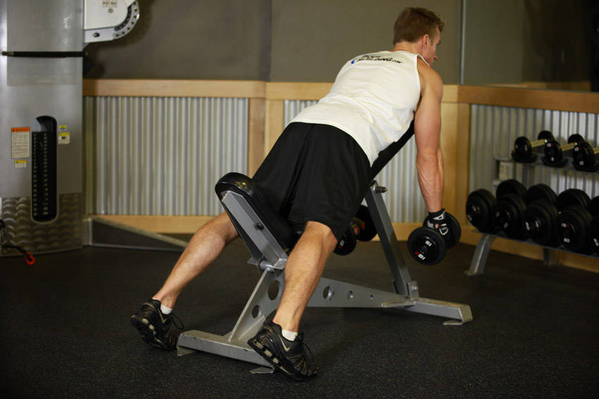 Demonstration of Middle Back Shrug exercise showing proper form and technique