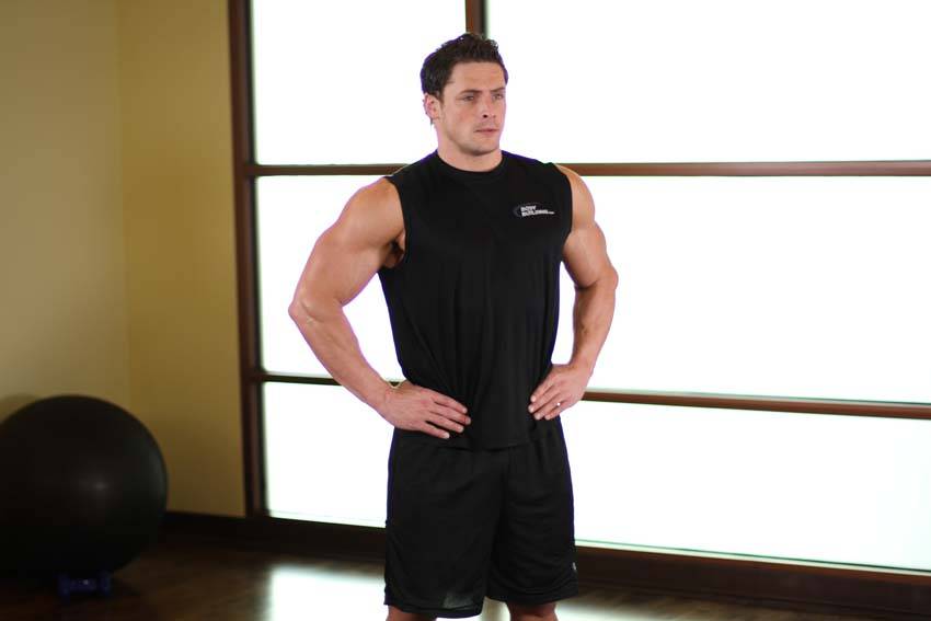 Demonstration of Middle Back Stretch exercise showing proper form and technique