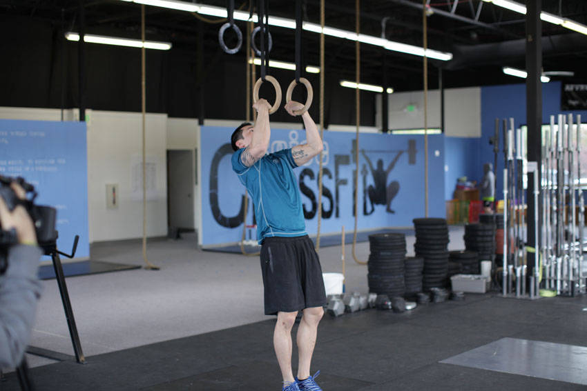 Demonstration of Muscle Up exercise showing proper form and technique