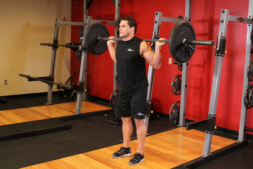 Demonstration of Narrow Stance Squats exercise showing proper form and technique