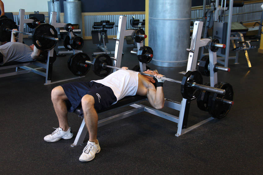 Demonstration of Neck Press exercise showing proper form and technique