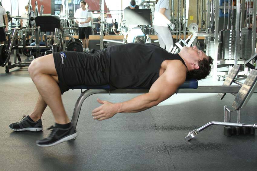 Demonstration of On-Your-Back Quad Stretch exercise showing proper form and technique