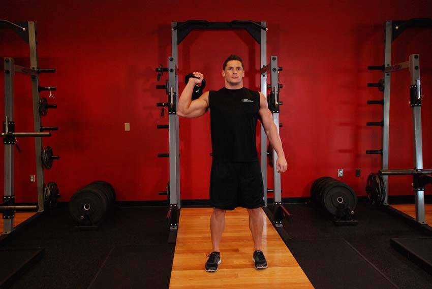 Demonstration of One-Arm Kettlebell Para Press exercise showing proper form and technique
