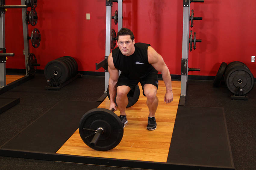 Demonstration of One-Arm Side Deadlift exercise showing proper form and technique