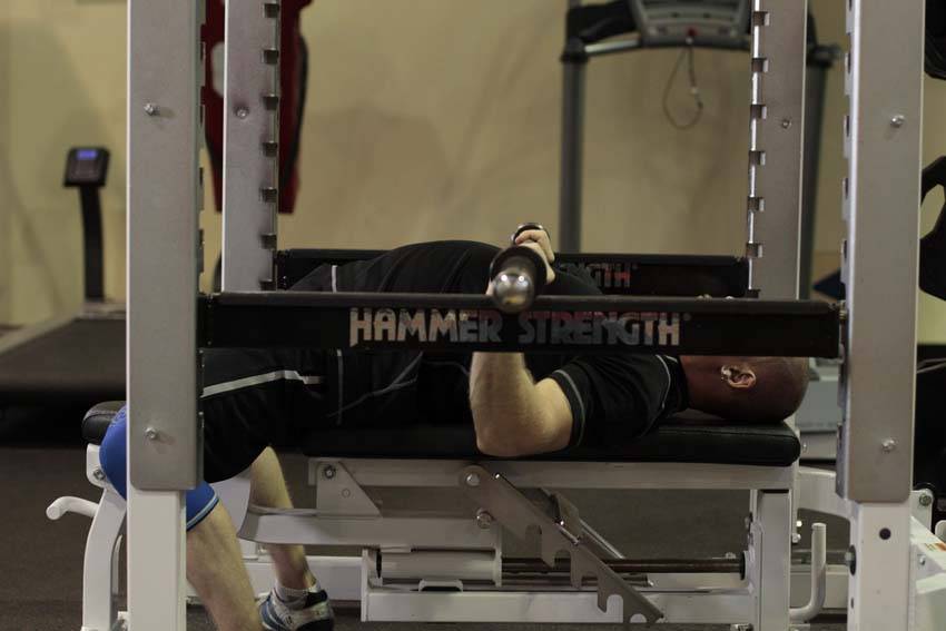 Demonstration of Pin Presses exercise showing proper form and technique