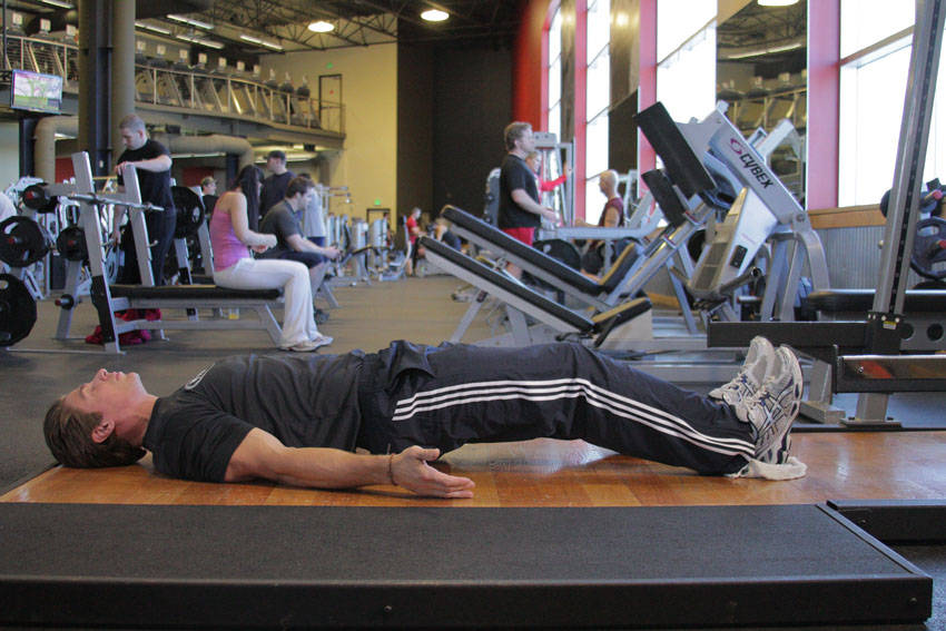 Demonstration of Platform Hamstring Slides exercise showing proper form and technique