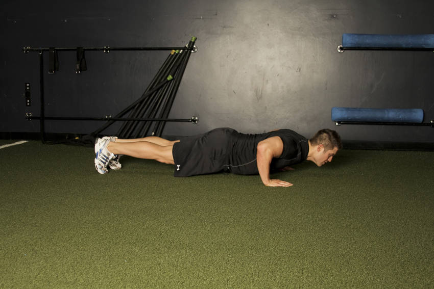 Demonstration of Plyo Push-up exercise showing proper form and technique