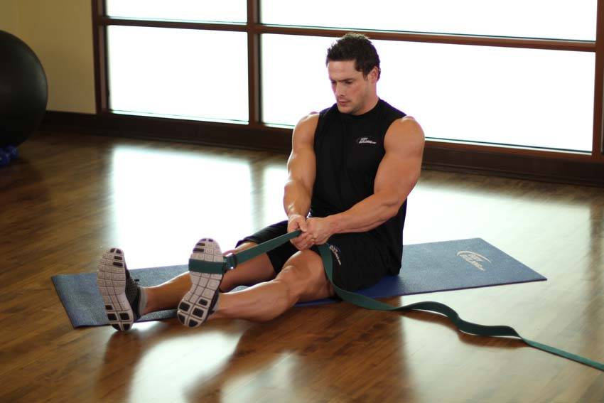 Demonstration of Posterior Tibialis Stretch exercise showing proper form and technique