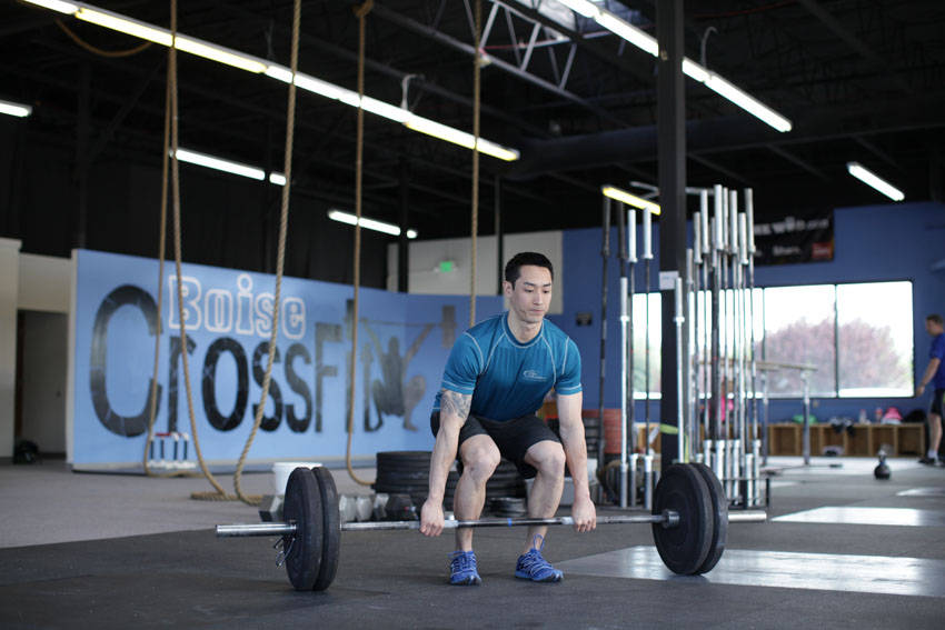 Demonstration of Power Clean exercise showing proper form and technique
