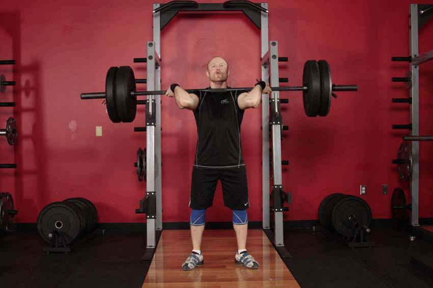Demonstration of Power Jerk exercise showing proper form and technique