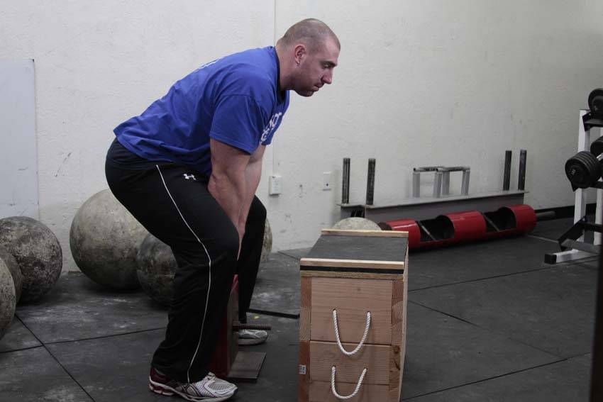 Demonstration of Power Stairs exercise showing proper form and technique