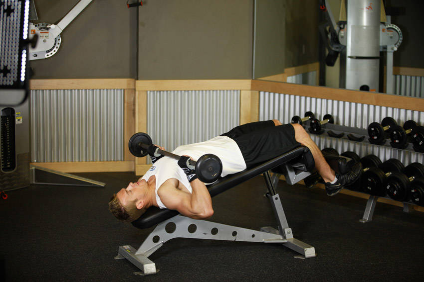 Demonstration of Press Sit-Up exercise showing proper form and technique