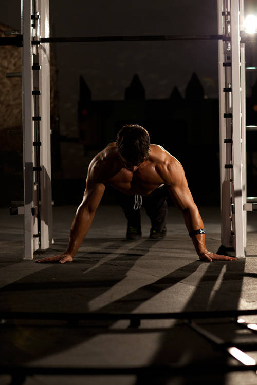 Demonstration of Push-Up Wide exercise showing proper form and technique