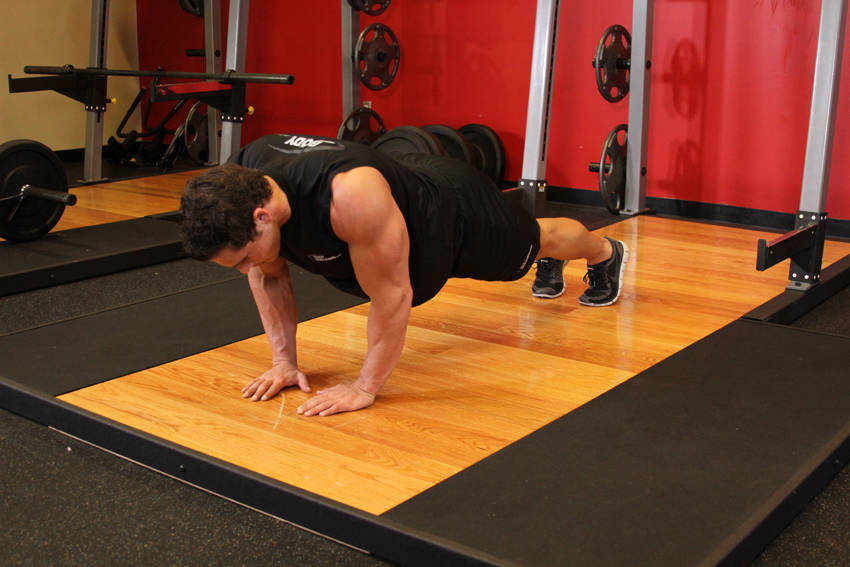 Demonstration of Push-Ups - Close Triceps Position exercise showing proper form and technique