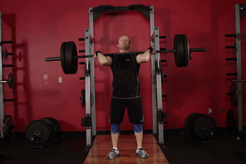 Demonstration of Push Press exercise showing proper form and technique