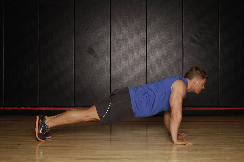 Demonstration of Push Up to Side Plank exercise showing proper form and technique