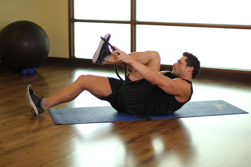 Demonstration of Quad Stretch exercise showing proper form and technique
