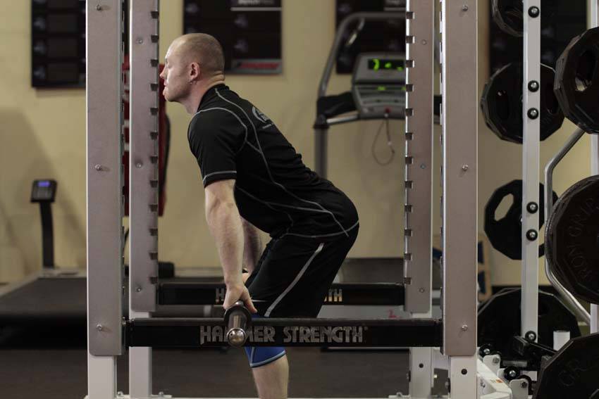 Demonstration of Rack Pulls exercise showing proper form and technique