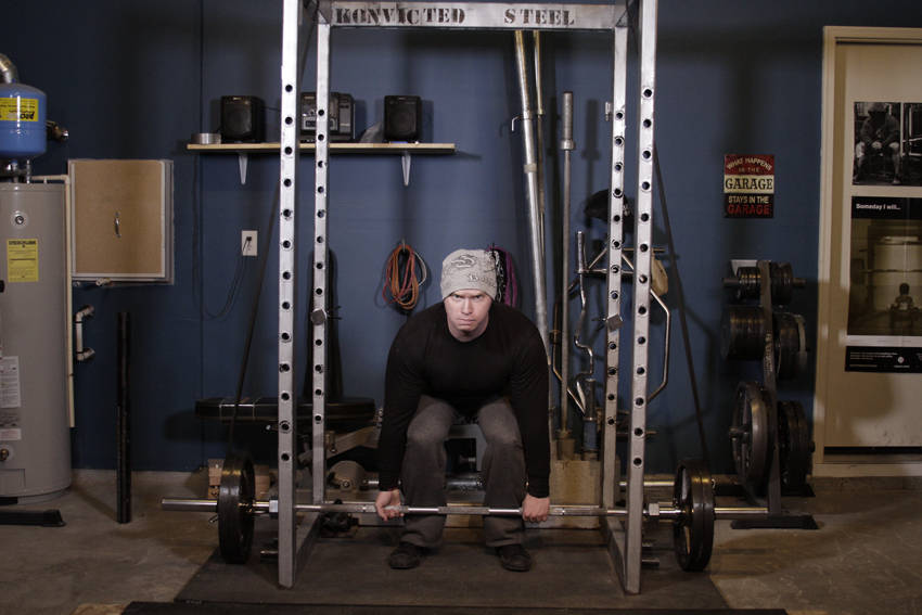 Demonstration of Reverse Band Deadlift exercise showing proper form and technique