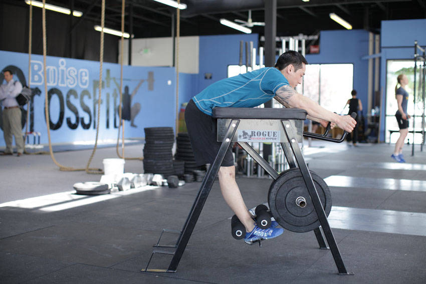 Demonstration of Reverse Hyperextension exercise showing proper form and technique