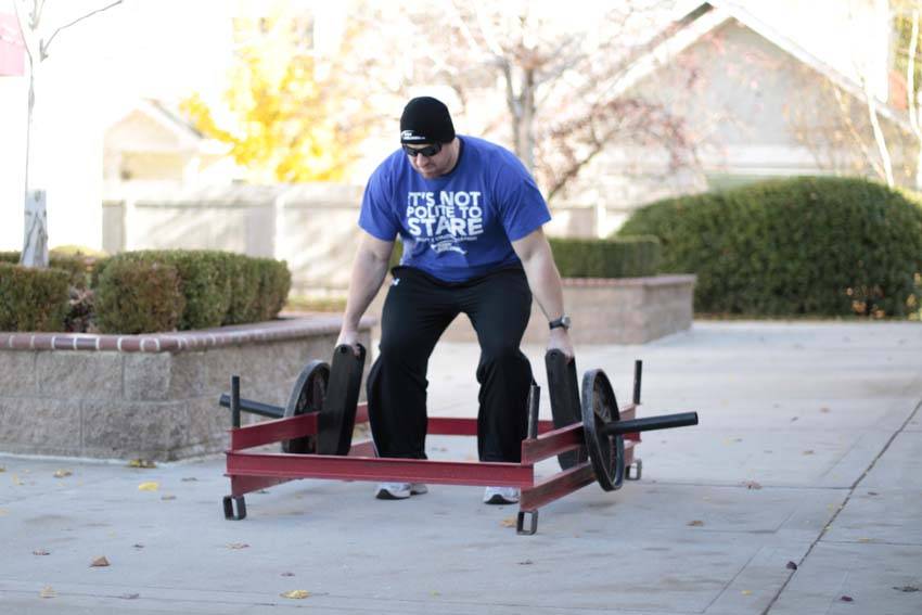 Demonstration of Rickshaw Deadlift exercise showing proper form and technique