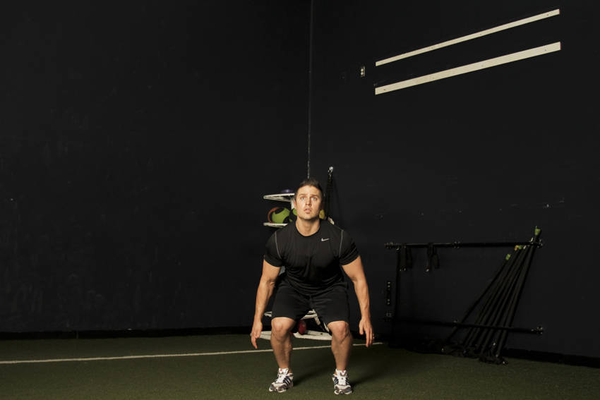 Demonstration of Rocket Jump exercise showing proper form and technique