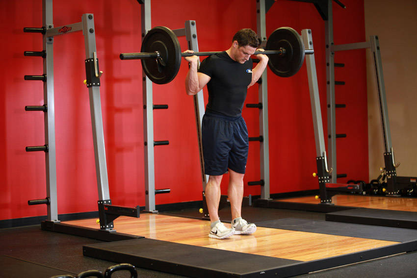 Demonstration of Rocking Standing Calf Raise exercise showing proper form and technique