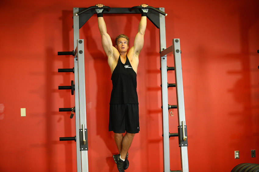 Demonstration of Rocky Pull-Ups/Pulldowns exercise showing proper form and technique