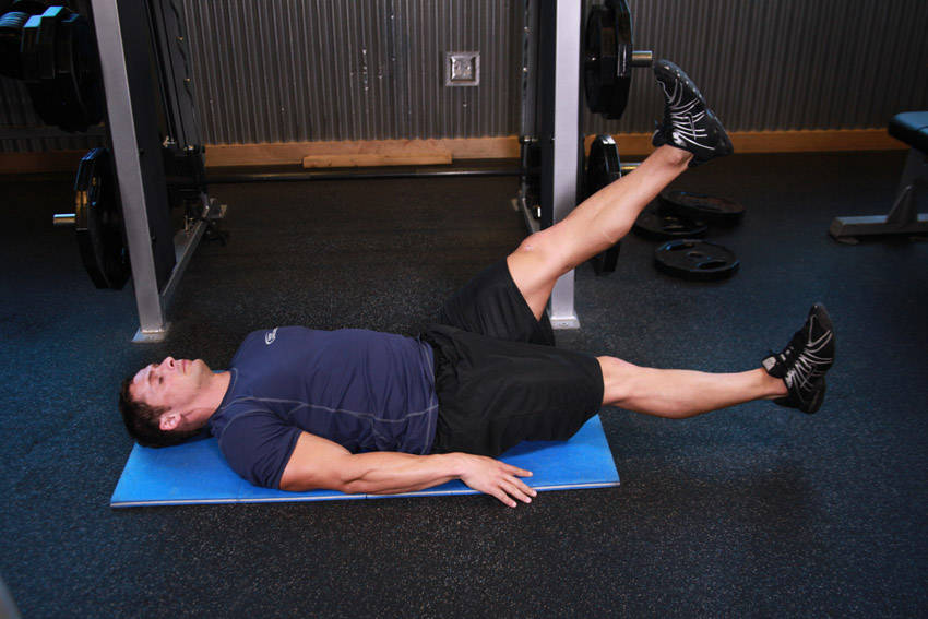 Demonstration of Scissor Kick exercise showing proper form and technique